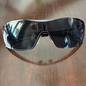 Oakley Black Shield Sunglasses with Decorative Temples. Comes with hard case.